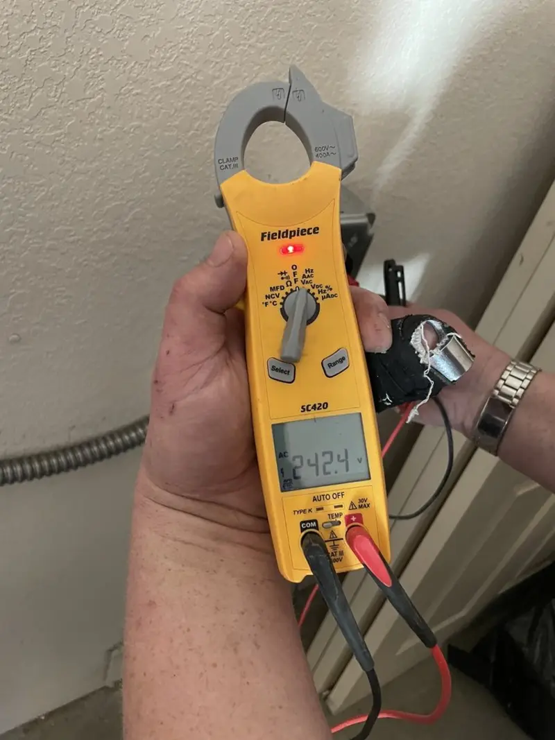 Voltage testing with clamp meter during Electrical Installation Services in Three Rivers